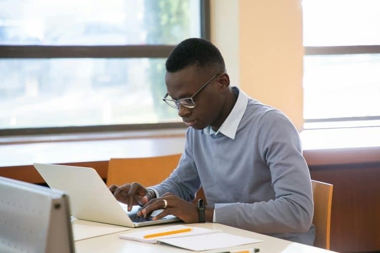 Freshman student studying with a laptop
